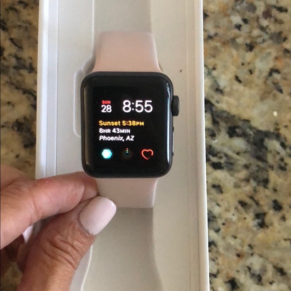space gray apple watch with pink band